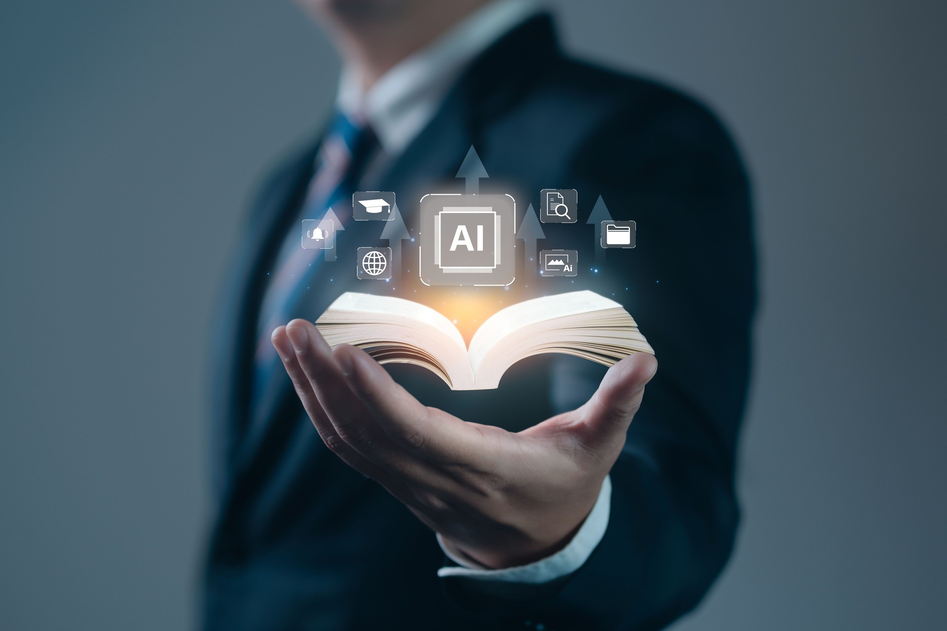 AI Education Book on hand of businessman with icon AI Education